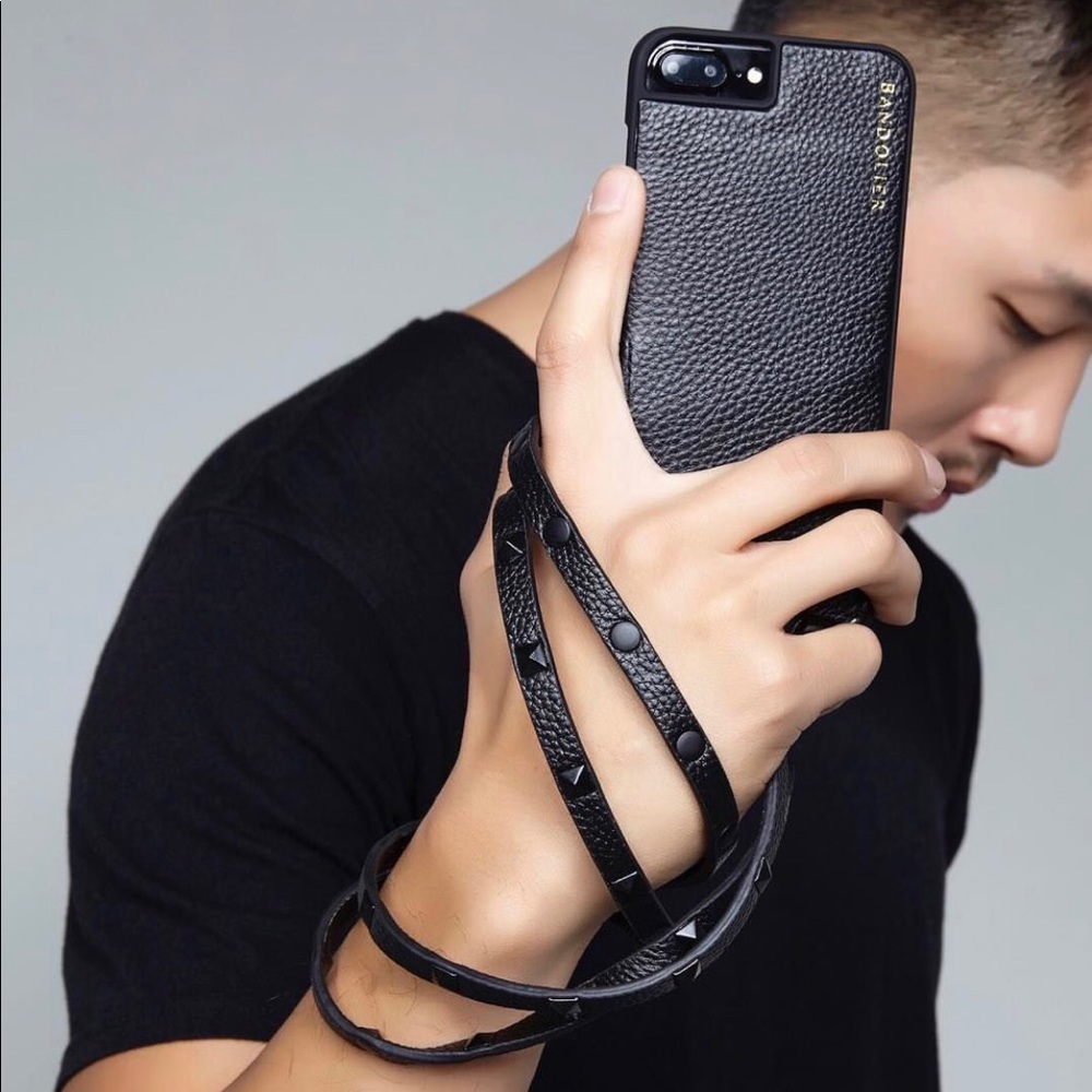 Bandolier iPhone plus case with studded strap.